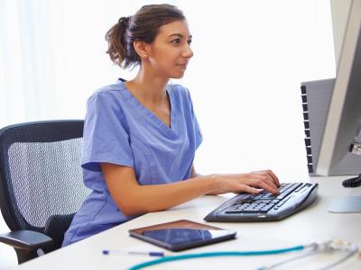 nurse in front of computer